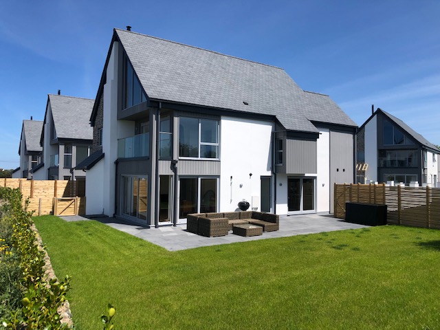 Rear terraces of the new homes at The Meadows, St Merryn